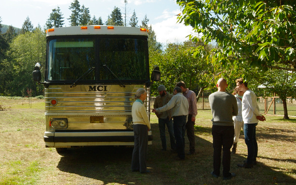 Looking over the very handsome new tour bus.